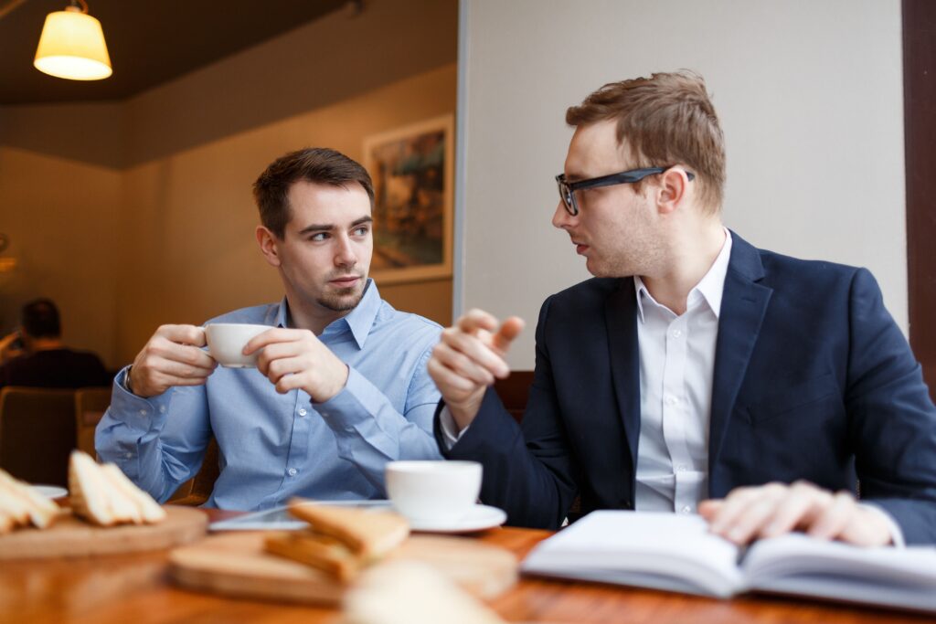 Boss_and_salesman_toasting_to_business_success_with_clients